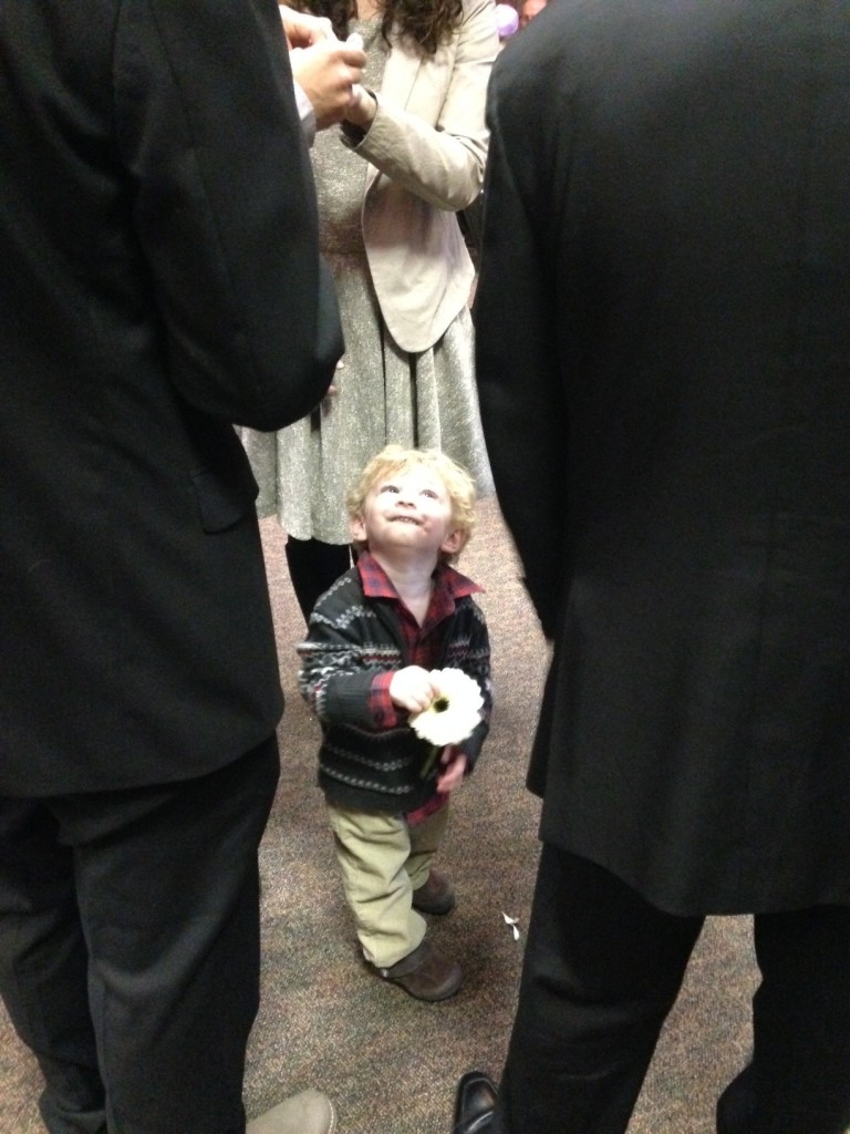 Child watching parents signing